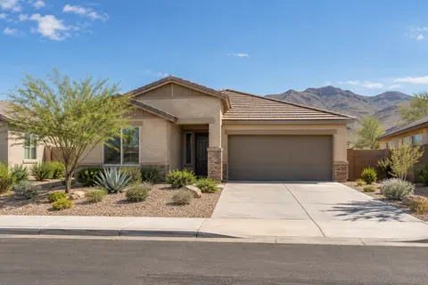 Illustrative single-story Southwestern home with desert landscaping. Not a depiction of Alamar Landmark Collection or an available home.