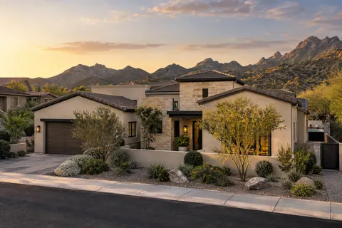 Illustrative Arizona home with varied rooflines, desert landscaping, and distant mountains. Not a depiction of Enclave or an available home.