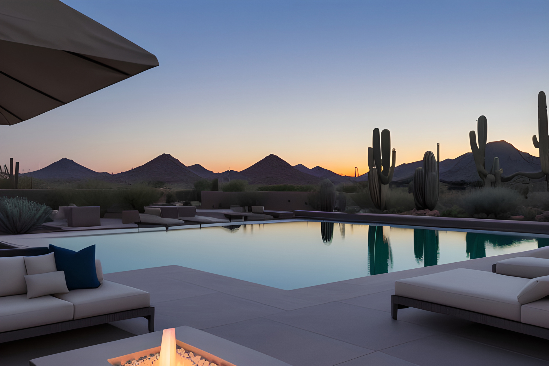 Pool and Fire Pit in the backyard of a Luxury Property in peoria, AZ at dusk with arizona mountain views beyond the pool.