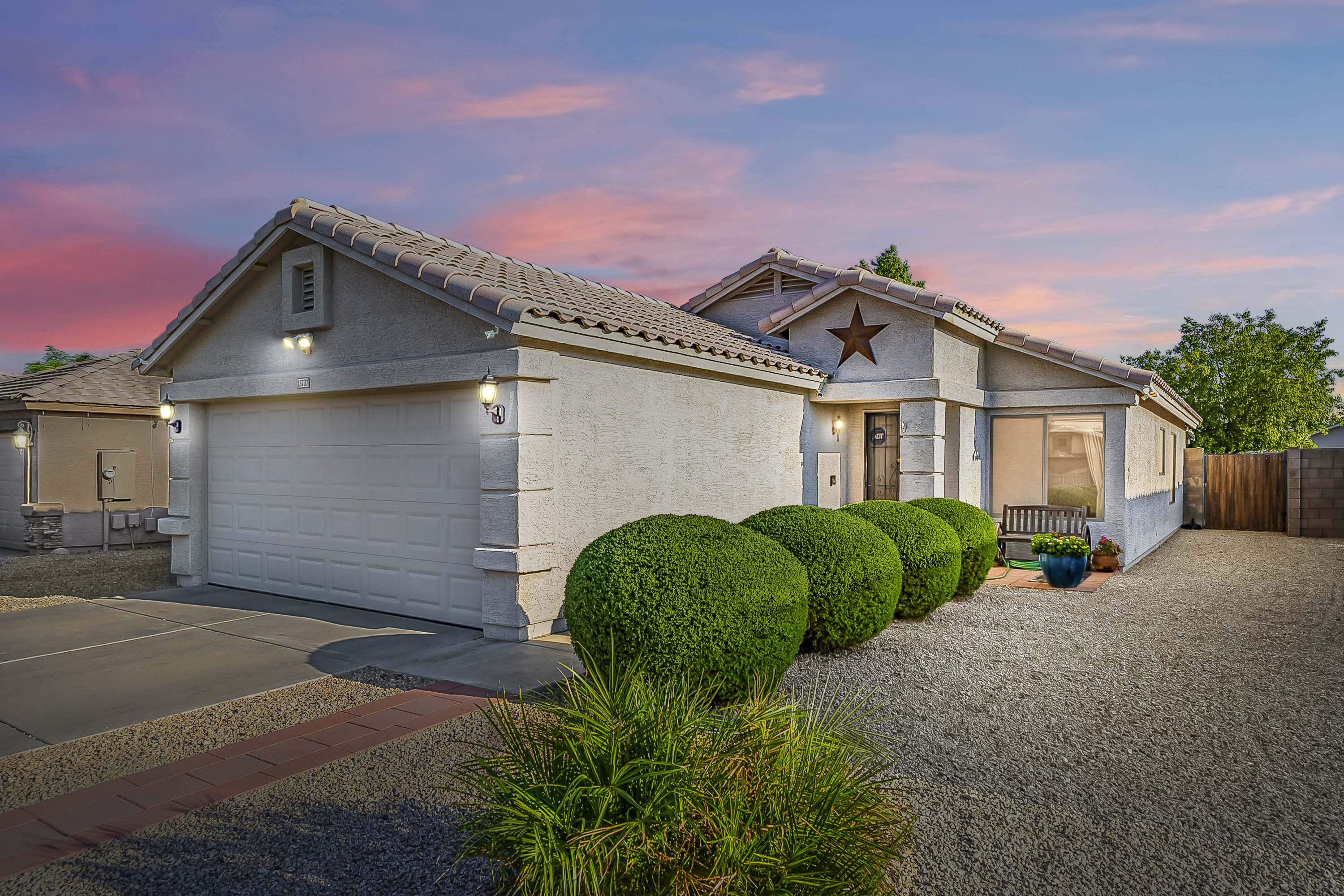 Single-story Arizona home with low-maintenance landscaping at sunset