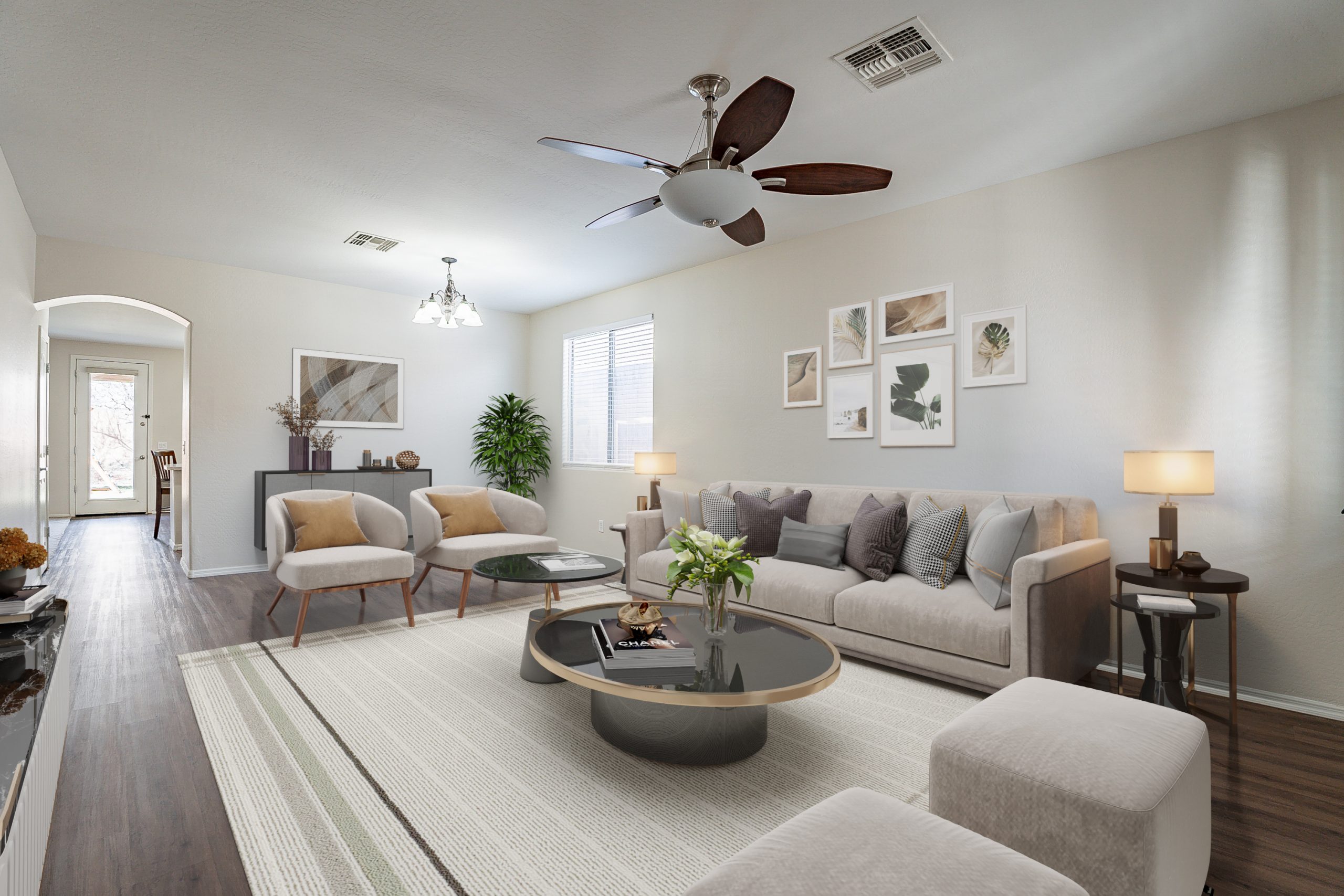 Andrew Piane Peoria, AZ sold home showing the living room decorated with white couches and bright open floor plan lighting