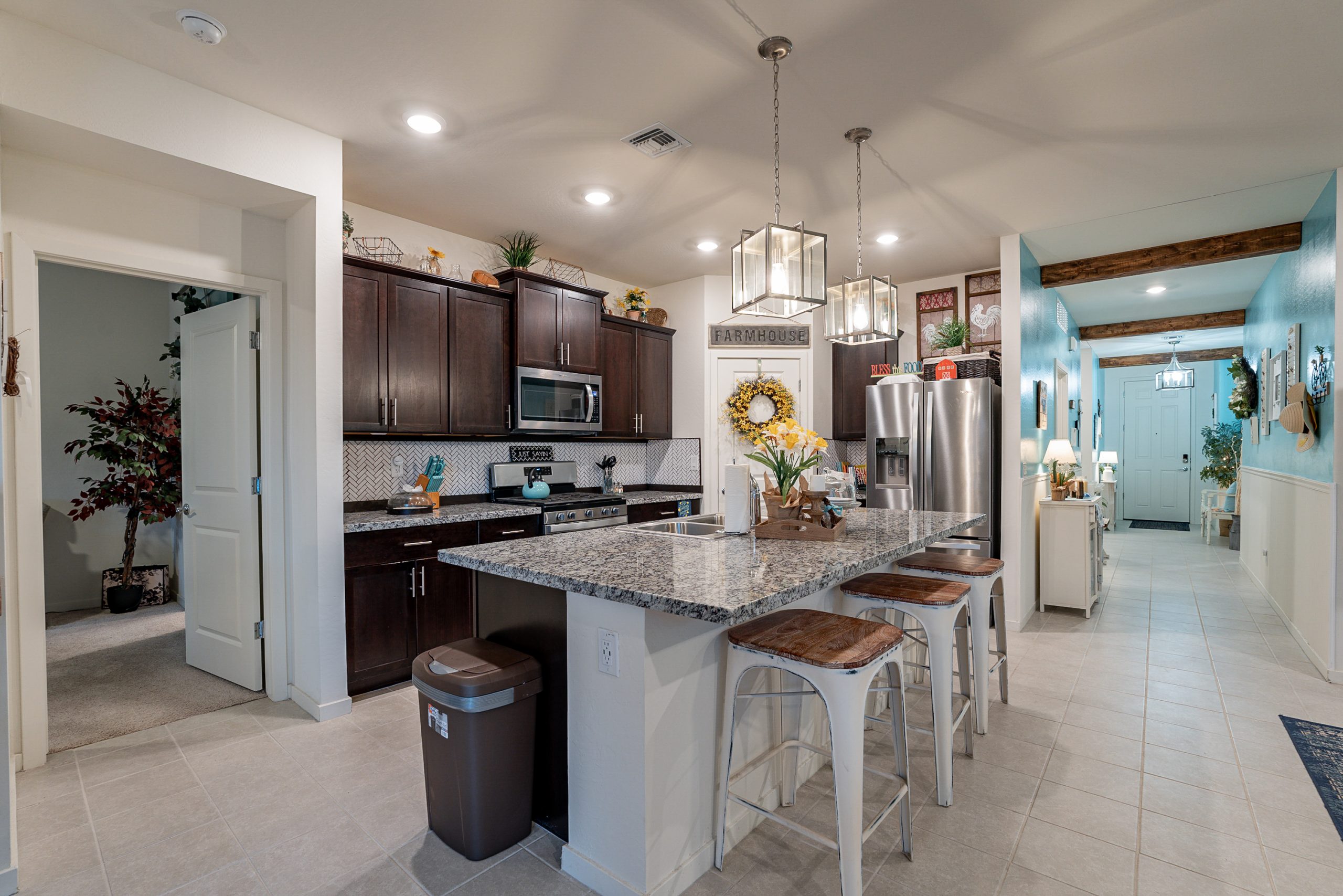 Andrew Piane Glendale, AZ sold home showing the kitchen with pendant lighting and quartz countertops