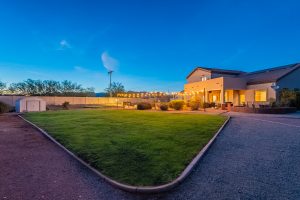listing photo in litchfield park, az of property with two RV gates and a casita