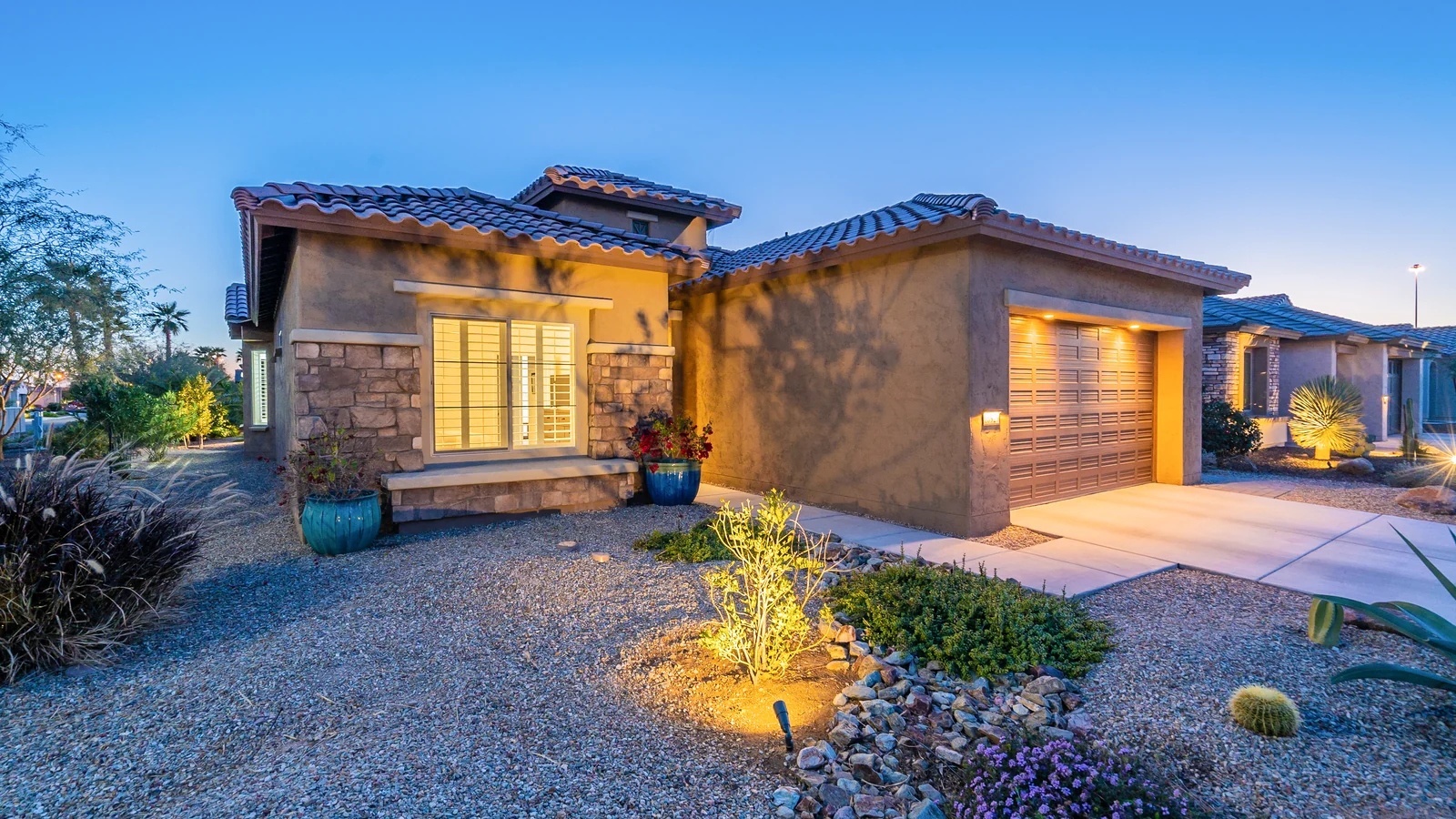 Arizona Home Exterior at Twilight Arizona stucco home exterior with illuminated windows at twilight