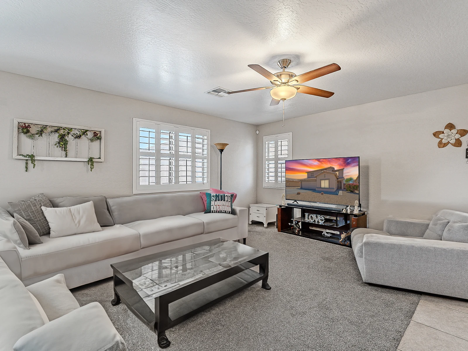 tolleson-living-room-pioneer Living room with seating and plantation shutters in a Tolleson Arizona home